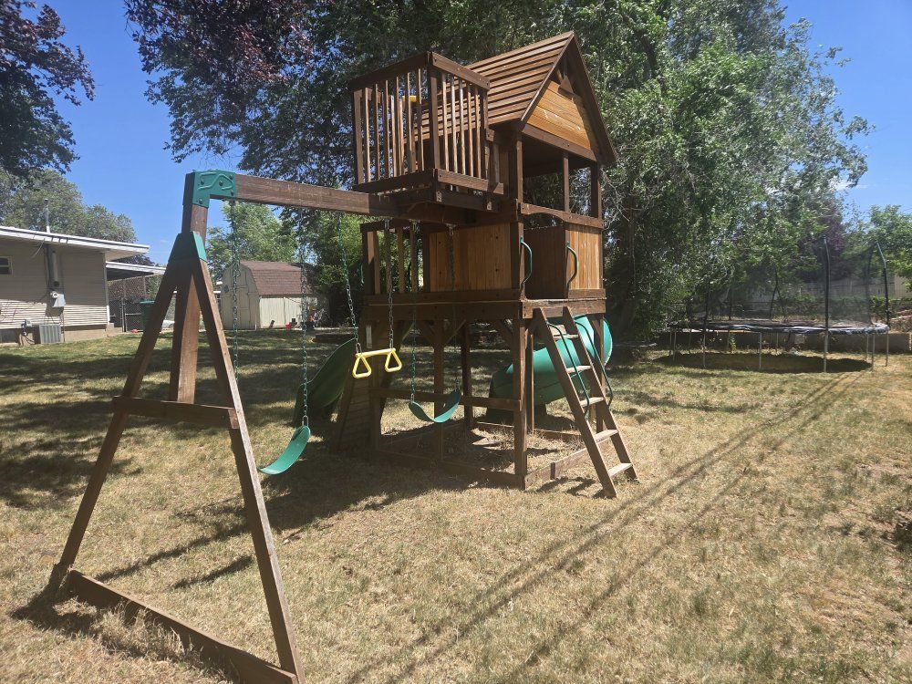 Used Backyard Discovery Playset w/ Tube & Wave Slides, Swing Set & Rock Wall