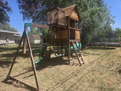 Used Backyard Discovery Playset w/ Tube & Wave Slides, Swing Set & Rock Wall