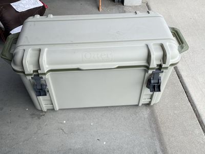 OtterBox Venture 45 Hard Cooler - Tan/Green - Durable Outdoor Ice Chest with Dry Basket