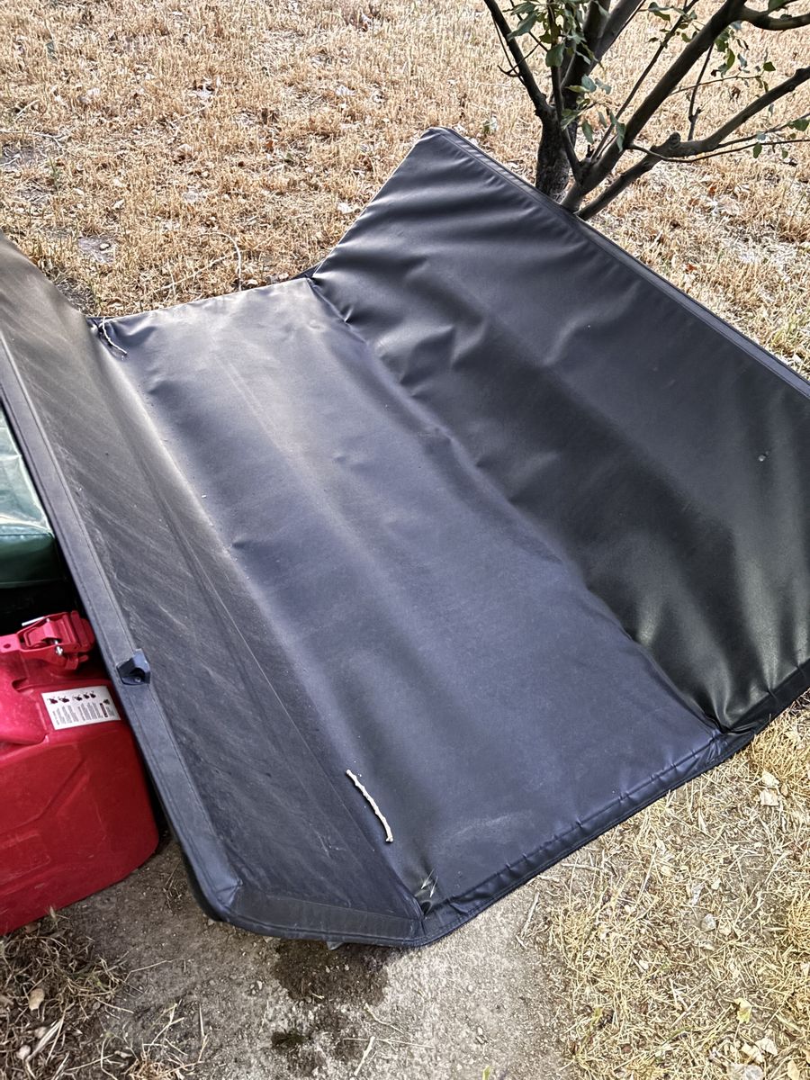 Used Truck Bed Cover Tonneau Black Foldable. Used on Ram 1500. (Condition: UsedFair)
