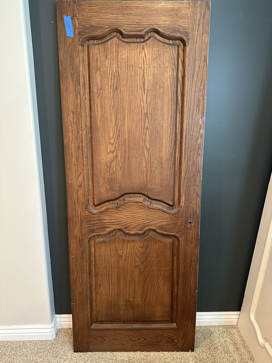 Quality solid wood interior doors removed during a remodel. These are not hollow-core or MDF—they are solid wood construction.