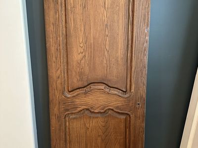 Quality solid wood interior doors removed during a remodel. These are not hollow-core or MDF—they are solid wood construction.