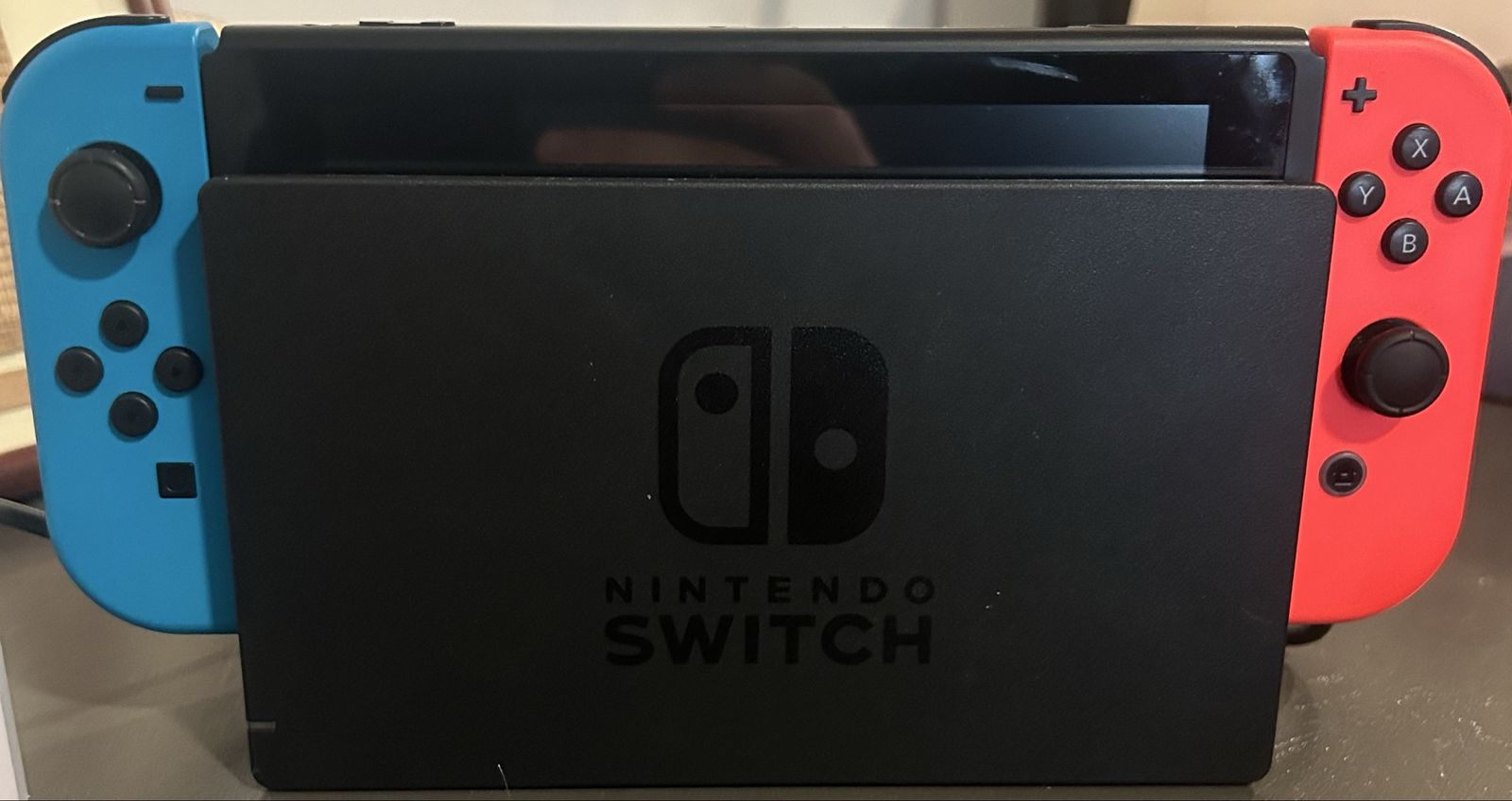 Nintendo Switch w/ joy cons, charging cable, dock, and carrying case. 