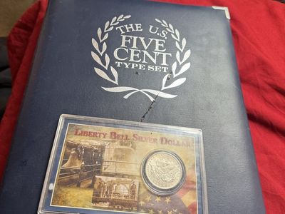 Liberty Bell silver dollar 1885 O and US five cents type set