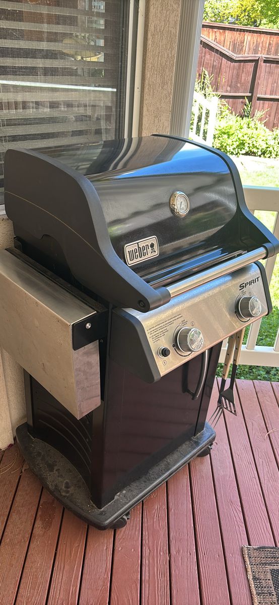 Weber Spirit Gas Grill - Black and Stainless Steel, two burner, includes propane tank and Weber cover