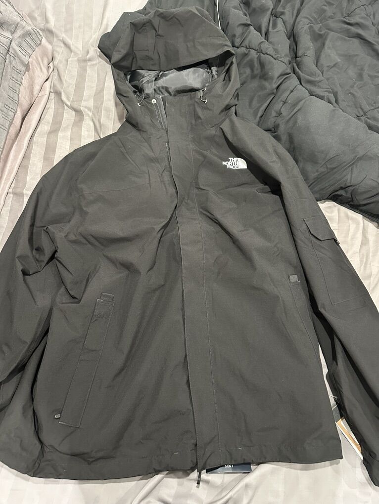 The North Face black triclimate jacket.