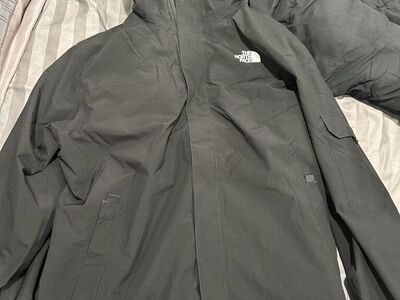 The North Face black triclimate jacket.