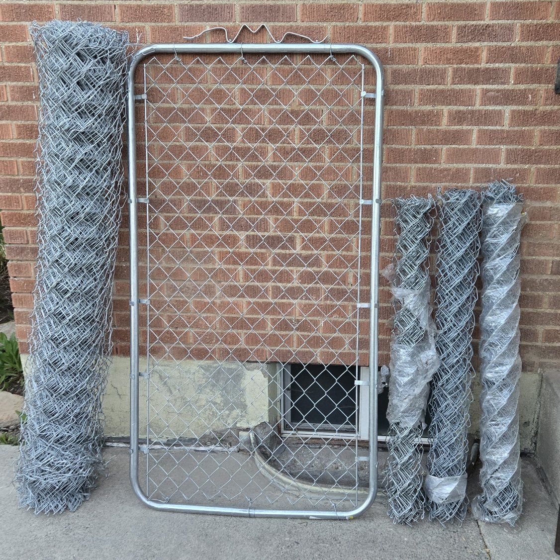 Chainlink fence roll and man gate