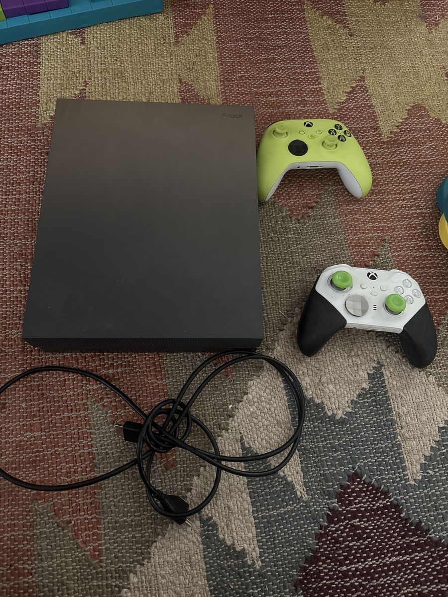 Xbox One X and 2 Controllers