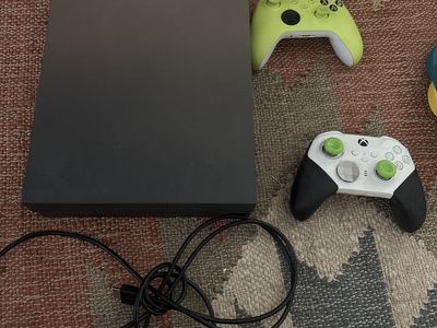 Xbox One X and 2 Controllers