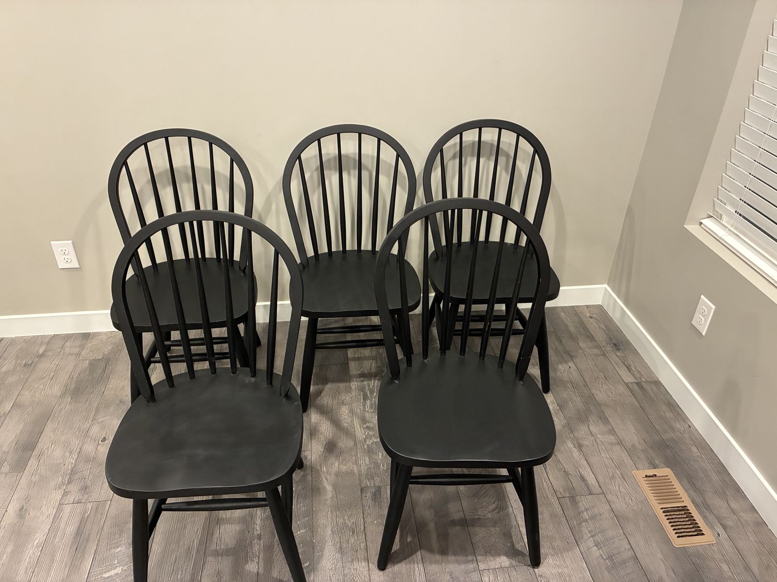 Set of five matte black dining chairs