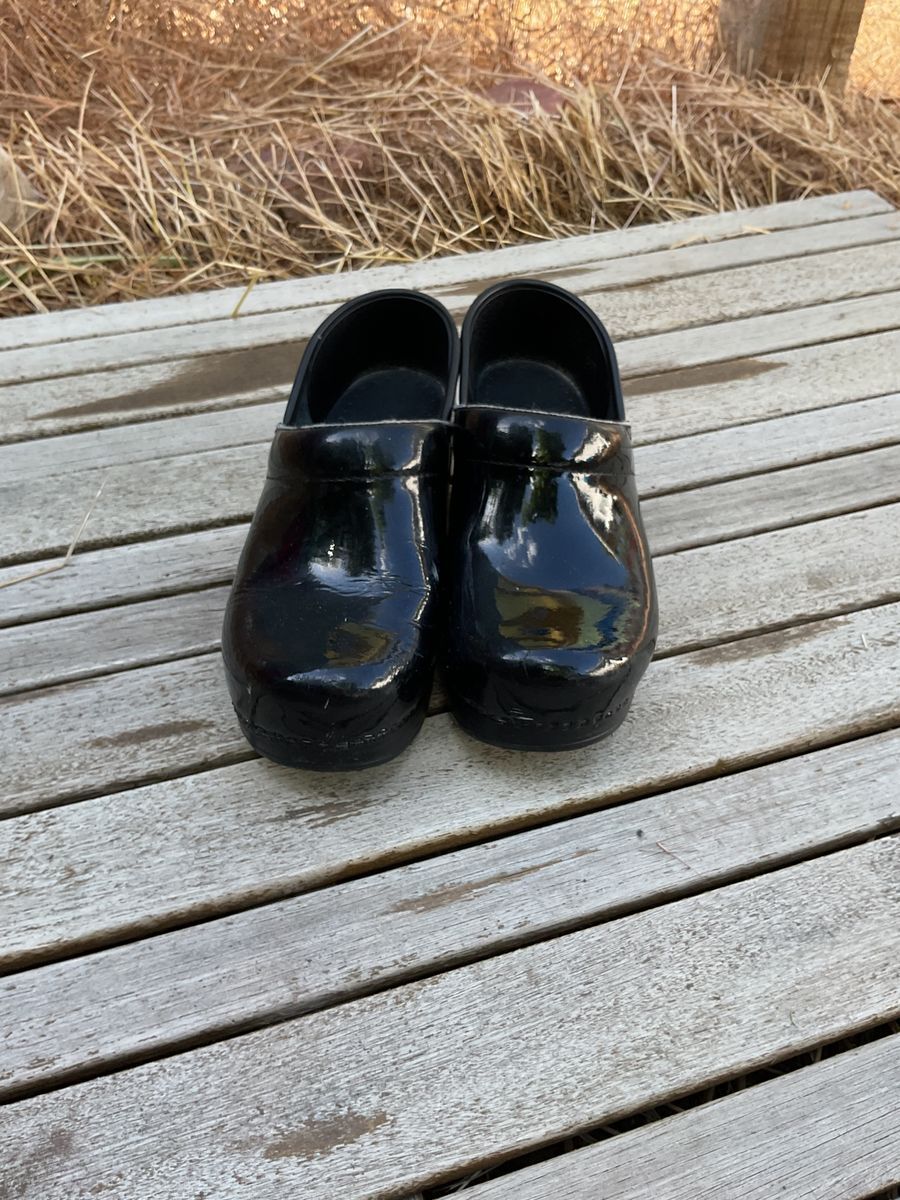black glossy clogs