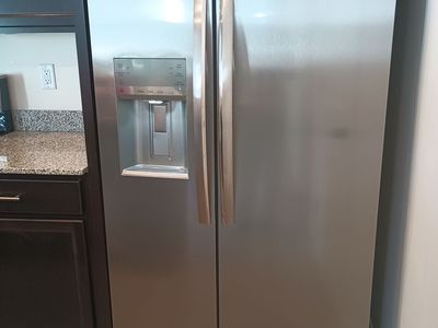 Side by side stainless steel refrigerator