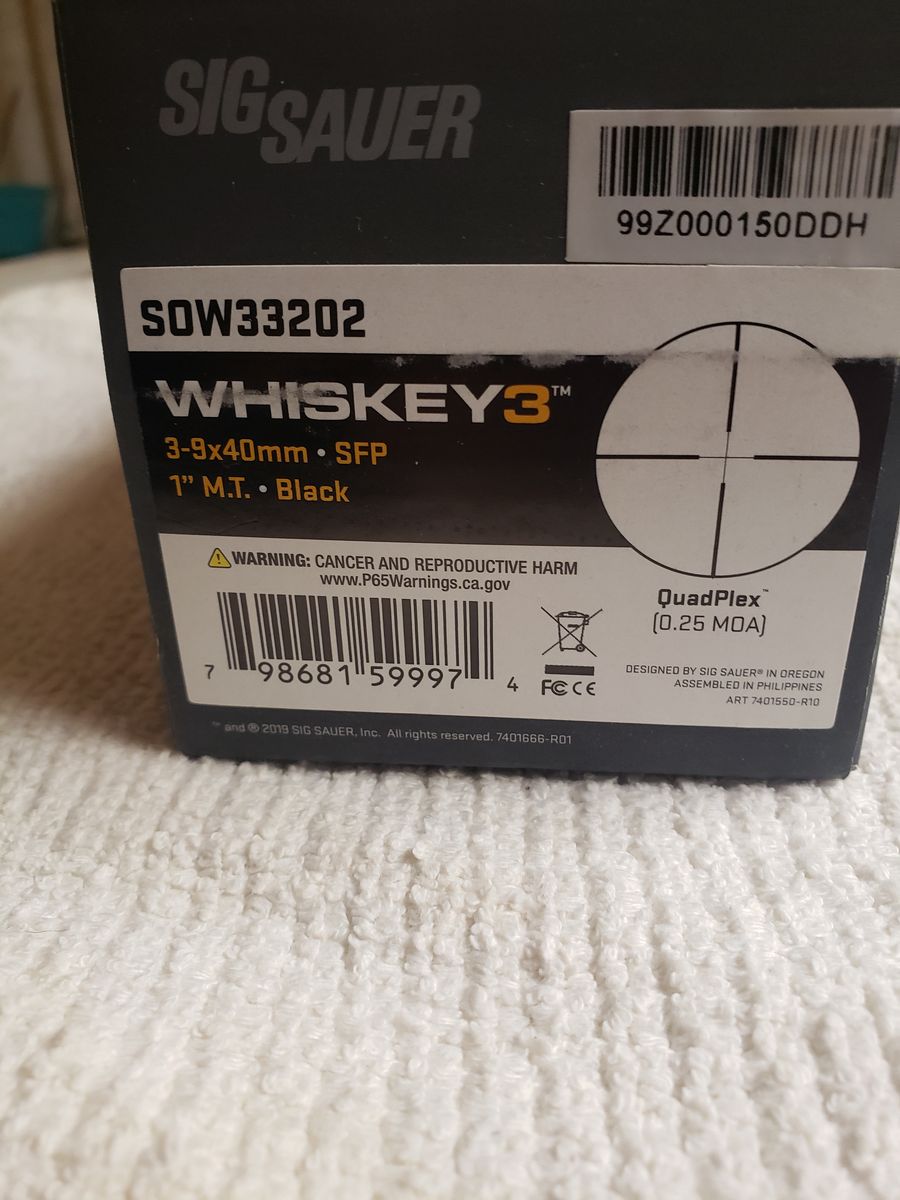 rifle scope, new in the box, with rings