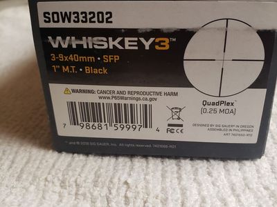 rifle scope, new in the box, with rings