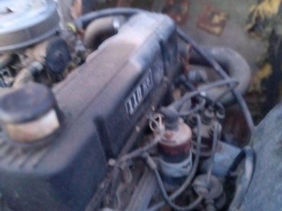 Old Boat with a four cyl Chev motor .