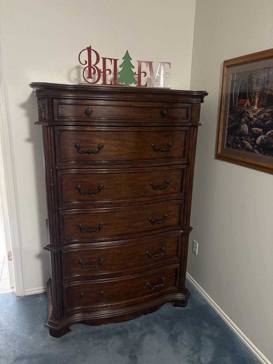 Dark Wood Tall Dresser with Multiple Drawers and Ornate Hardware