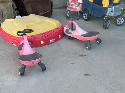 2 red PlasmaCar wiggle cars.