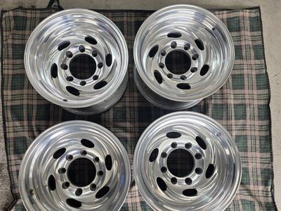 8x170 Polished 8-Lug Wheels (Set of 4) with Center Caps. EAGLE ALLOYS