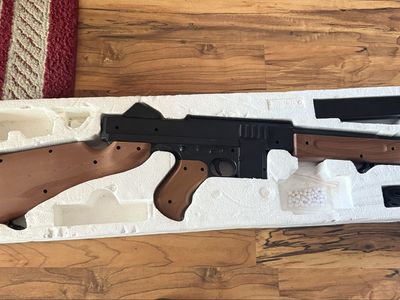 Double Eagle Thompson M306F spring-powered airsoft rifle.
