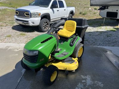 John Deere L130 w/ attachments.