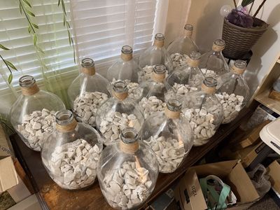 Large Clear Glass Demijohn Carboy Bottle with Jute Rope Detail and Decorative White Rocks