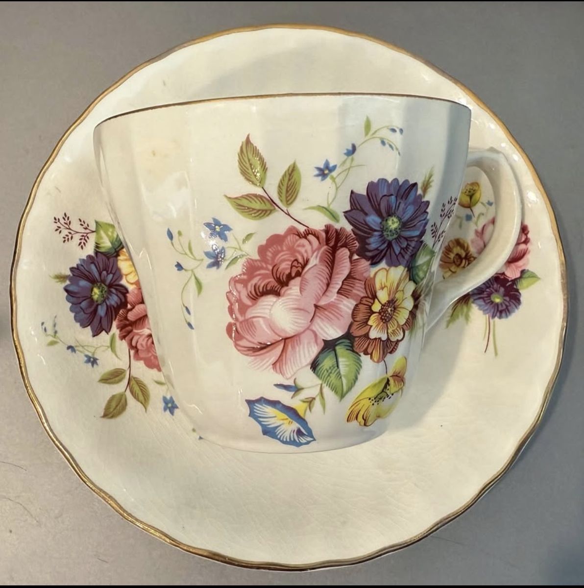 Vintage Floral Porcelain Teacup and Saucer Set with Gold Rim Accent