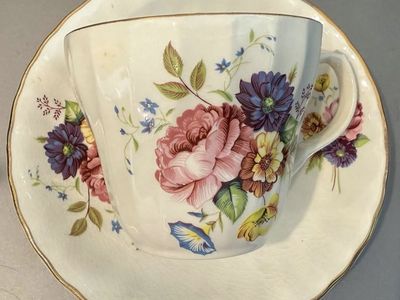Vintage Floral Porcelain Teacup and Saucer Set with Gold Rim Accent
