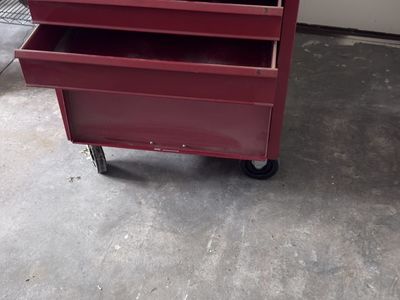 Red rolling tool box