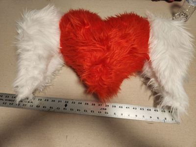 Heart pillow with angel wings