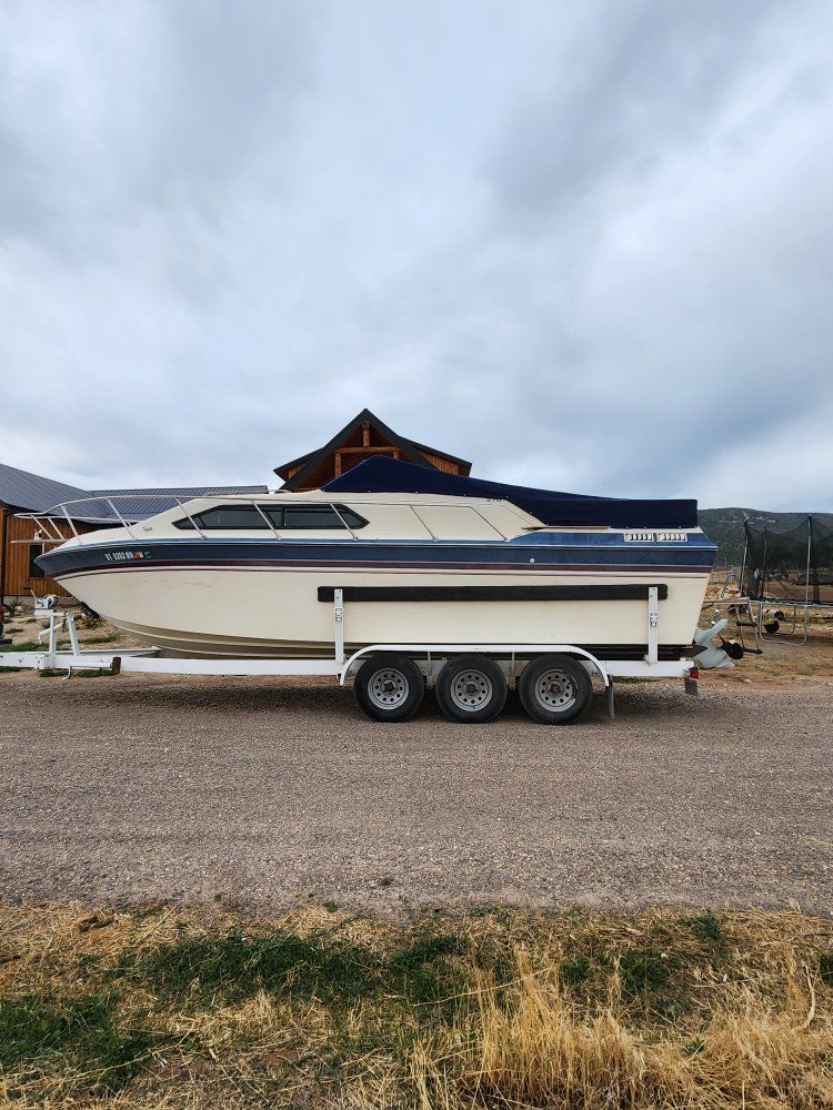 1984 Chaparrel Cobalt Cuddy Cabin Boat with Triple Axle Trailer, Cabin, Sink, and Portable Toilet