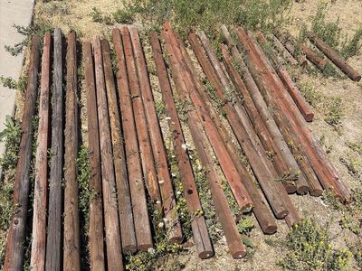 FREE Lot of Used Round Wooden Fence Posts and Wood Posts