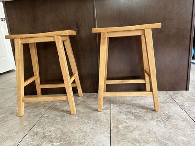 Pair of Wooden Bar Stools - Light Brown/Natural Wood, Saddle Seat Design