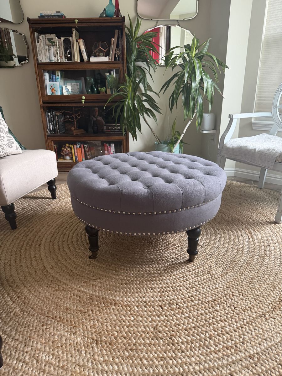 Round Tufted Ottoman Coffee Table, 36" Gray Linen-Style with Nailhead Trim and Casters