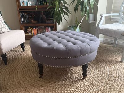 Round Tufted Ottoman Coffee Table, 36" Gray Linen-Style with Nailhead Trim and Casters