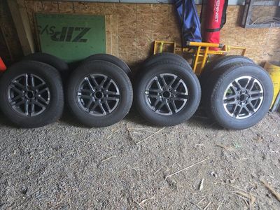 Set of 4 General Grabber HTS 225/75R16 Tires with Black/Silver Wheels