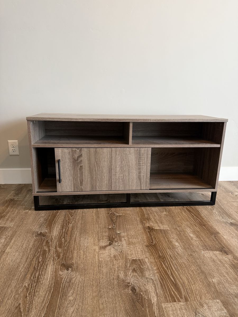 Modern Farmhouse TV Stand / Media Console with Sliding Barn Door, Wood Grain Finish, Black Metal Base