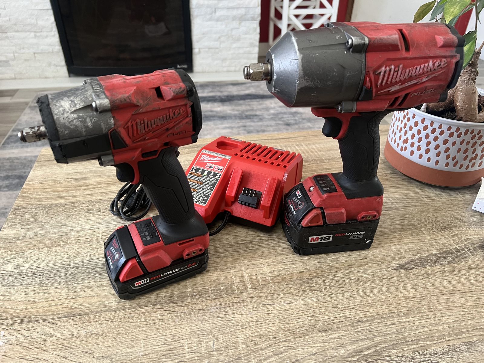 1/2 and 3/8 Milwaukee impacts with batteries and changer