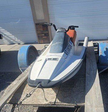 2 waverunners and trailer