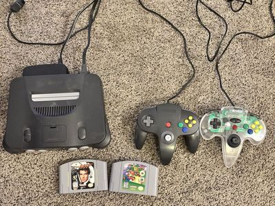 Nintendo 64 - 2 Games(Goldeneye and Super Mario 64) - 2 Controllers (1 Authentic).