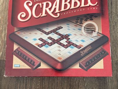This is a 2001 Parker Brothers Deluxe Turntable Scrabble crossword game board