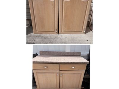Base and upper kitchen cabinets with granite top