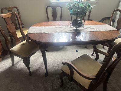 Five foot six inch traditional dining room table with 6 padded chairs.