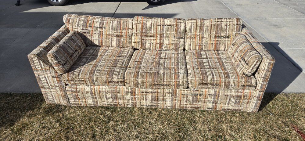 vintage 1970s tweed upholstered sofa.