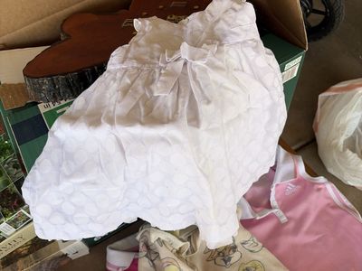 Sleeveless White Polka Dot Baby Dress with Front Bow Accent