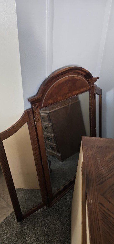 Nice long dresser with attached large mirror.