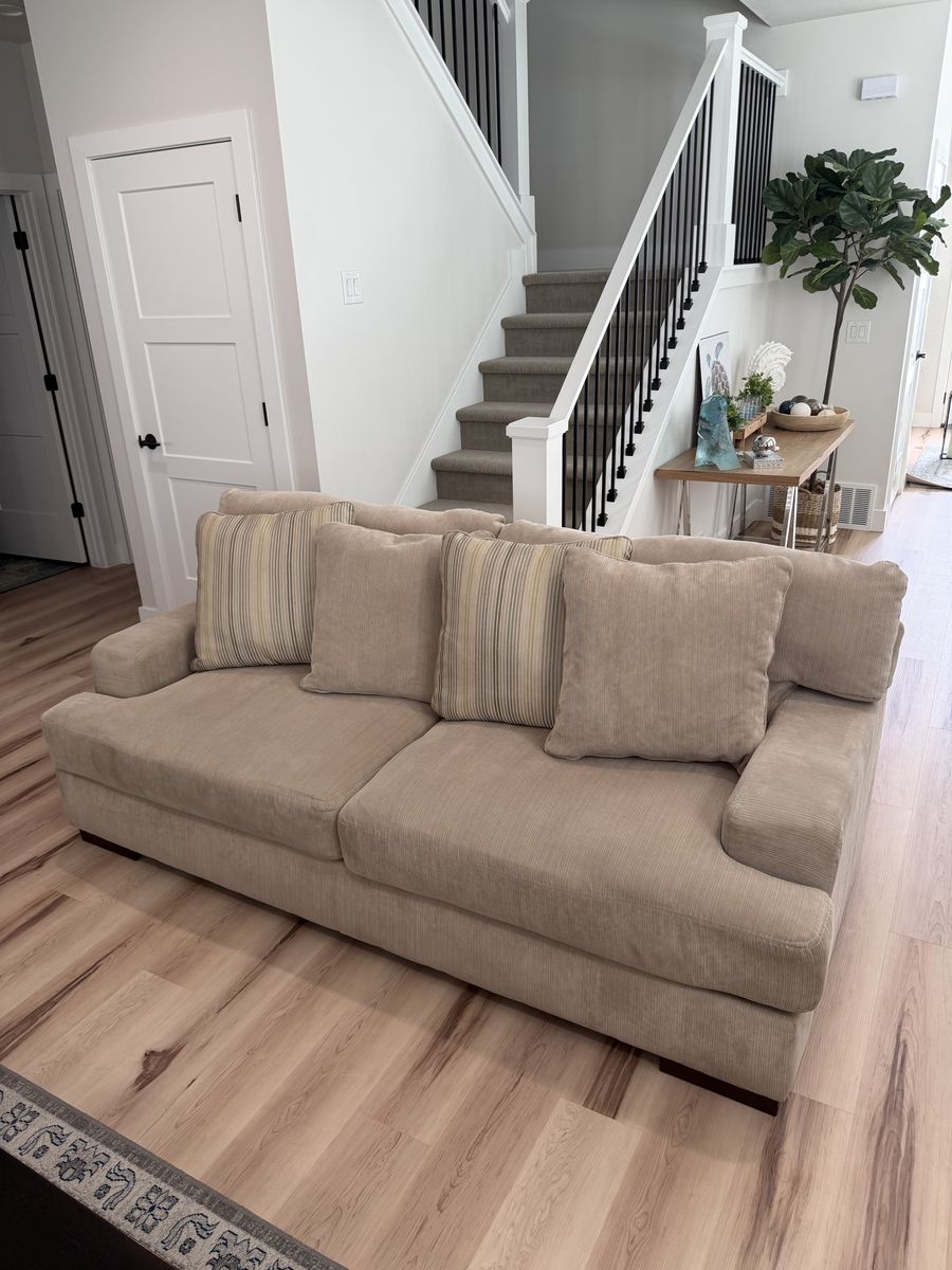 Cream couch with reversible pillows