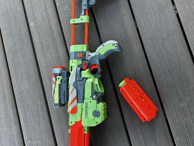Nerf Vortex Lumitron Blaster Green/Orange Toy Gun with Detachable Stock and Magazine