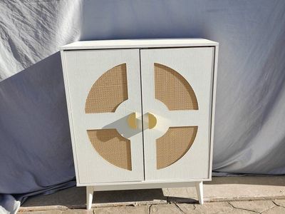 Stylish Vintage looking White 2-Door Cabinet with Cane Details and Gold Hardware