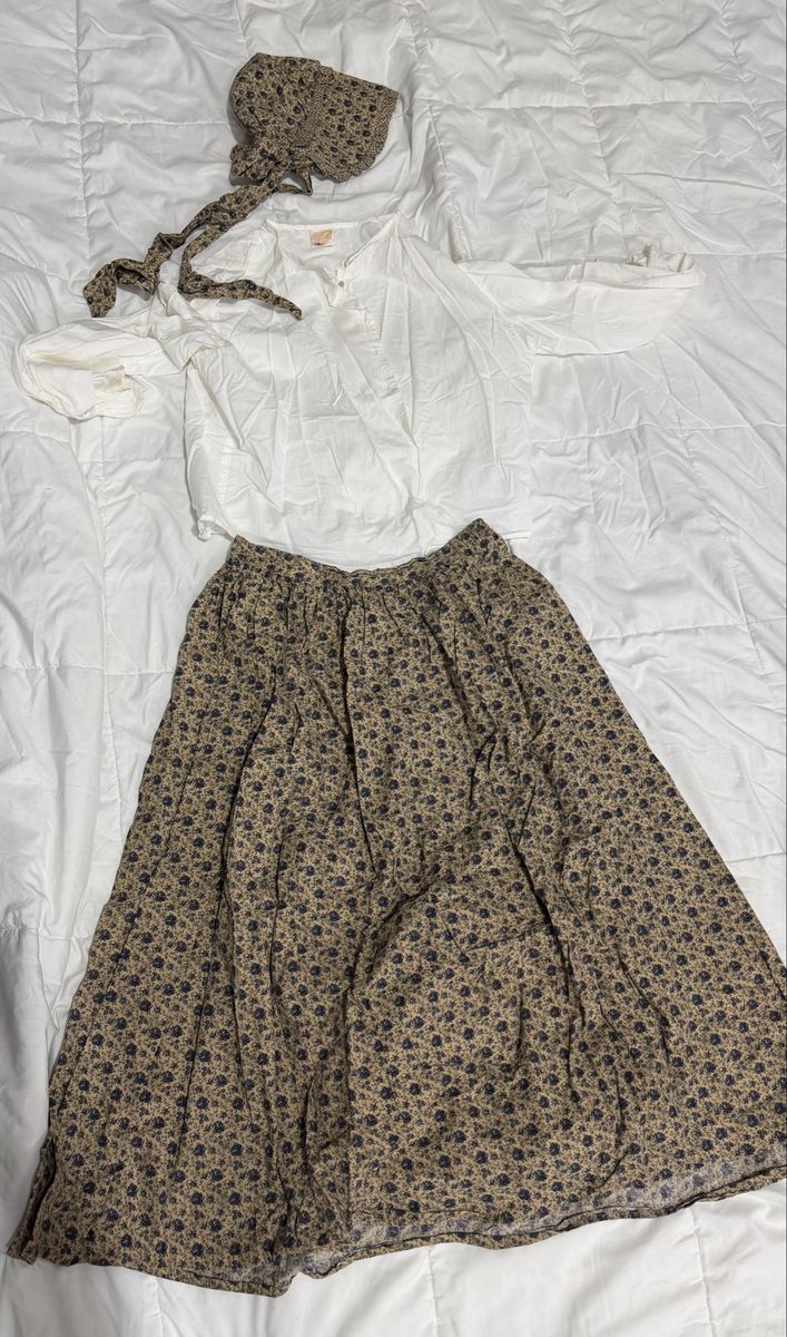 Khaki Pioneer skirt with matching bonnet, white blouse, and color coordinated apron.